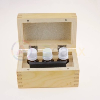 Wooden box with tools for metal test with natural stone and 3 glass bottles